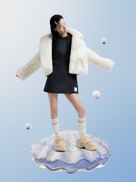 A person in a black dress Description automatically generated with low confidence