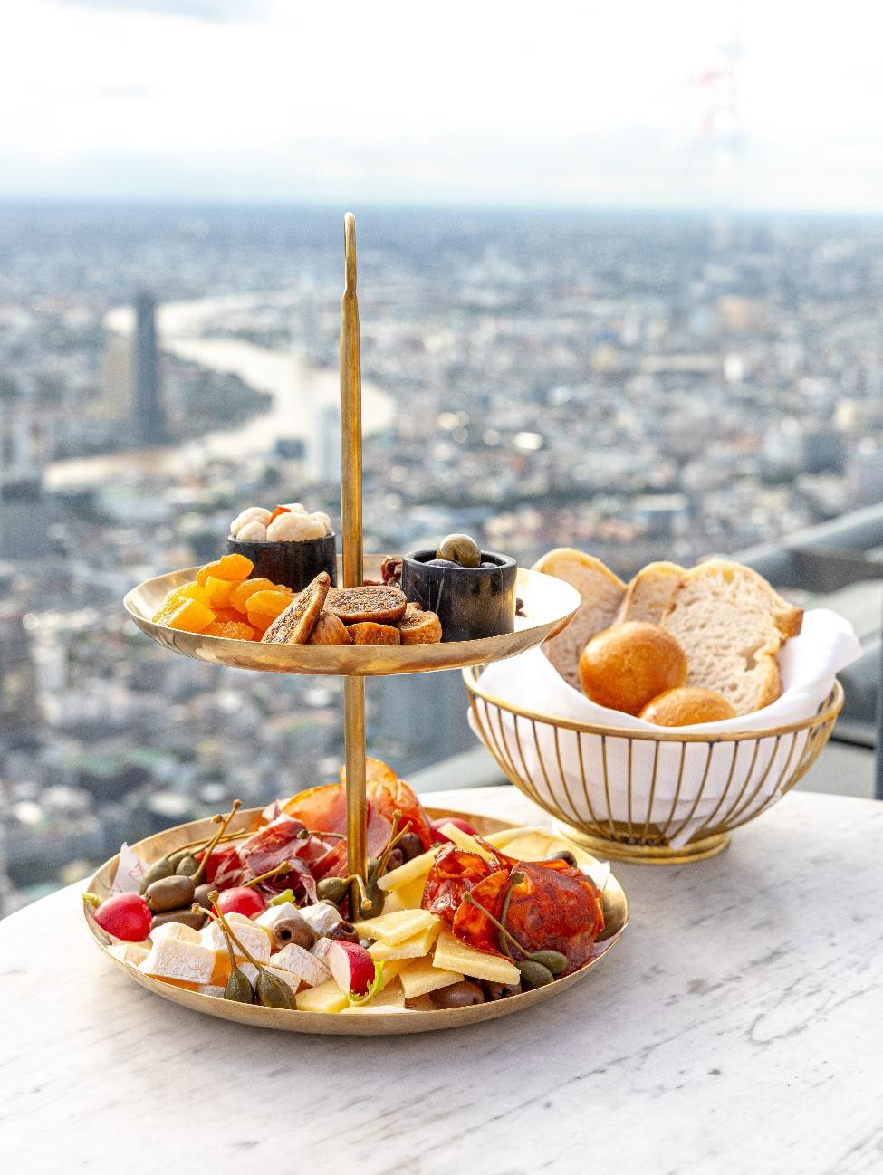 A tray of food and a basket of bread AI-generated content may be incorrect.