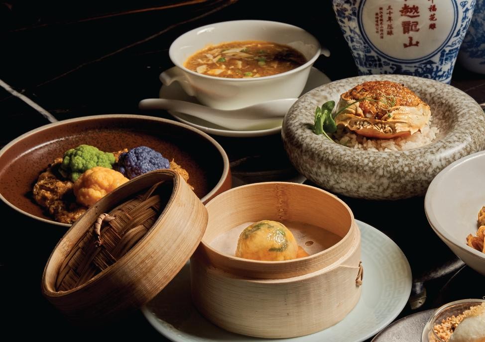 A table with different dishes AI-generated content may be incorrect.